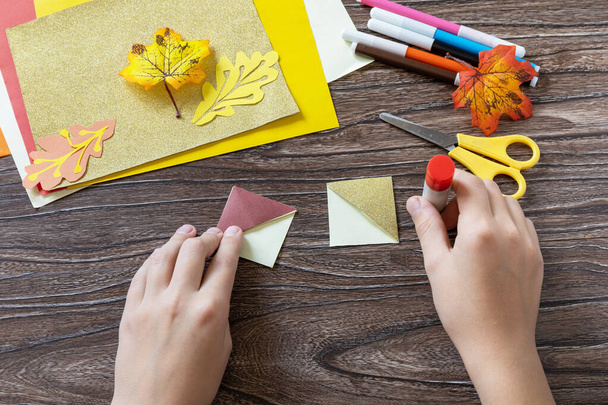 Instruction step 8. Thanksgiving craft bookmark turkey paper on a wooden table. Childrens art project, handmade, crafts for kids. - 写真・画像