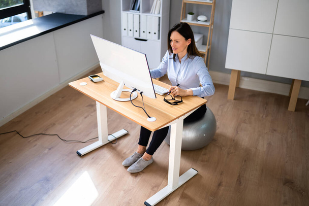 Correct Posture At Desk In Office Using Fitness Ball - Valokuva, kuva