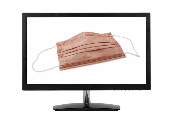 orvosi védőmaszk réz-oxiddal a számítógép monitoron - Fotó, kép
