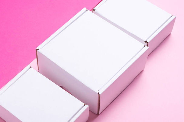 Set, lot of white cardboard box on color background, top view - Foto, afbeelding