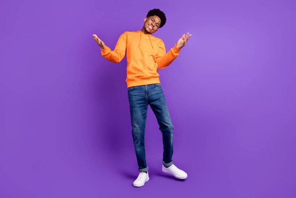 Full length photo of young afro man happy positive smile wear casual outfit isolated over violet color background - Фото, изображение