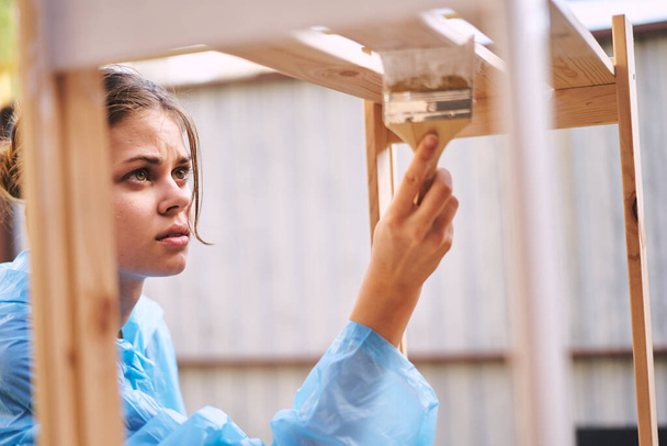 woman painter protective clothing wooden fittings renovation - Fotografie, Obrázek