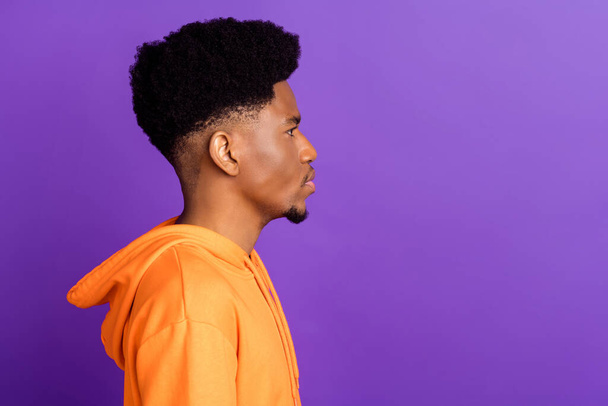 Profile side photo of young afro guy serious look empty space wear hoodie isolated over purple color background - Zdjęcie, obraz