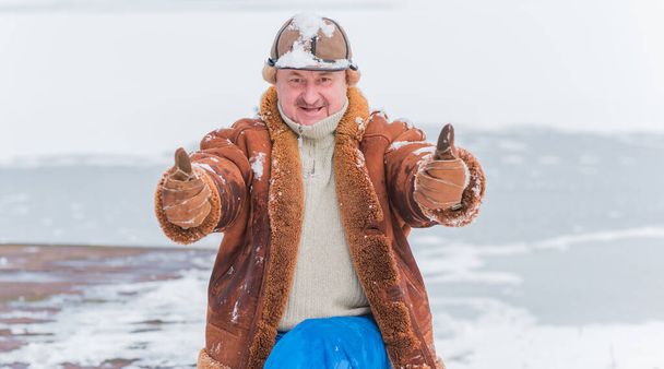 Lifestyle of older man on retired, senior man at winter snowy day at nature, recreation concept - Photo, Image