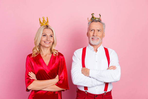 Portrait of two beautiful handsome trendy cheery dreamy spouses wearing tiara folded arms deciding isolated over pink pastel color background - Fotó, kép
