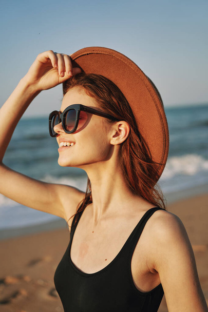 cheerful woman in sunglasses Sandy coast landscape sun - Photo, Image