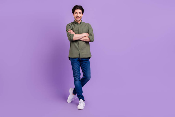Full size photo of positive happy cheerful young man hold hands folded enjoy confident isolated on violet color background - 写真・画像