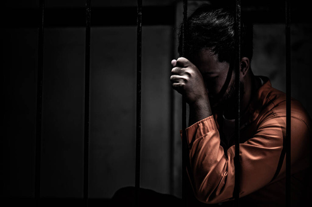 Portrait of man desperate to catch iron prison, prisoner concept - Φωτογραφία, εικόνα