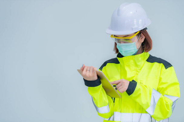 Asian engineer woman on white background - 写真・画像