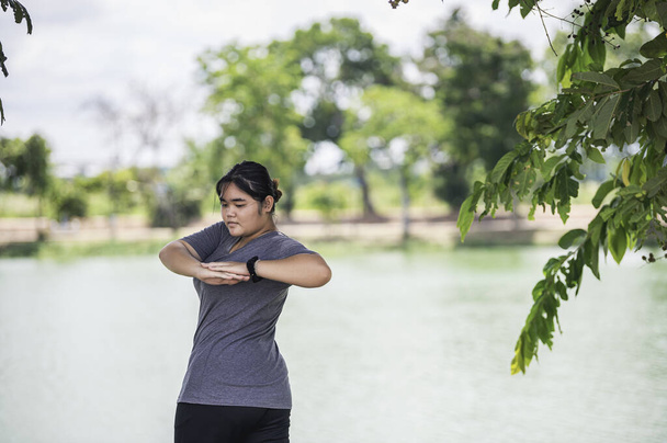 Beautiful asian fat woman play yoga at the park,Need to slim fit body - Φωτογραφία, εικόνα