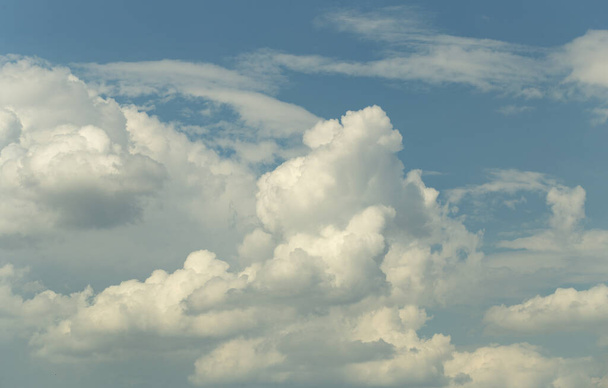 Cumuliform cloudscape on sky. Panorama. The sun is hidden.  Cumulonimbus clouds. - Photo, Image