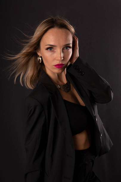 Stylish fashion young blonde woman in black clothes - Fotoğraf, Görsel