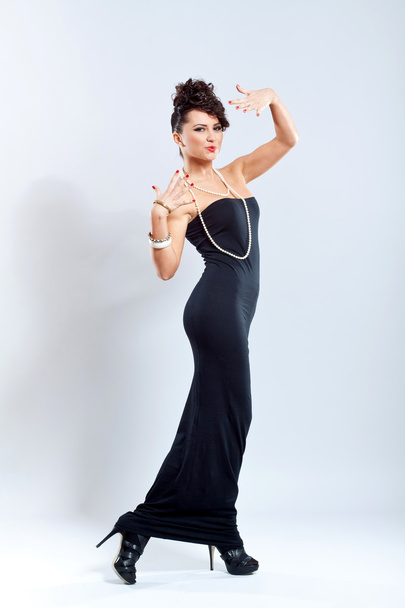 Fashion woman in elegant black dress, high heels - Valokuva, kuva