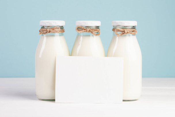 milk bottles copy space card. High quality photo - Φωτογραφία, εικόνα