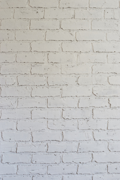 Decorative plaster on the wall in the form of white brickwork can be used as a background. - Foto, imagen