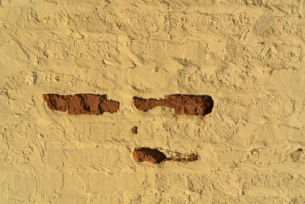 Old brick walls painted in ocher color. Creative vintage background. - Photo, Image