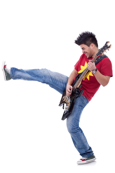 Kicking guitarist - Foto, Bild