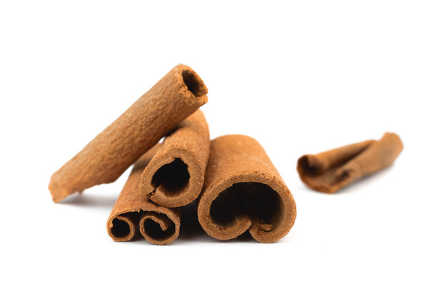 Cinnamon sticks isolated on a white background - Photo, Image