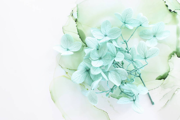 Creative image of pastel mint Hydrangea flowers on artistic ink background. Top view with copy space - Foto, immagini