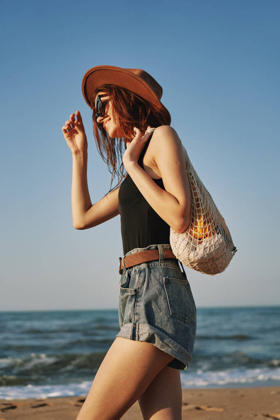 woman walking on the beach landscape sun fun lifestyle - Fotografie, Obrázek