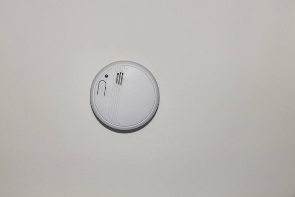 View of white home smoke alarm detector isolated. Security system concept. Sweden. - Foto, Imagen