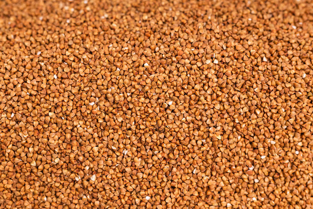 Fresh buckwheat background texture. Cereals and organic food concept - Foto, afbeelding