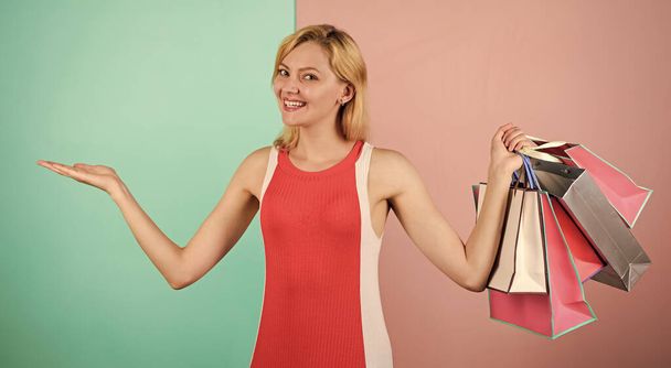 presenting summer discount. special offer on black friday. shop closeout. happy woman shopper. big sale. female shopaholic hold shopping bags. present packages for holiday preparation - Фото, изображение