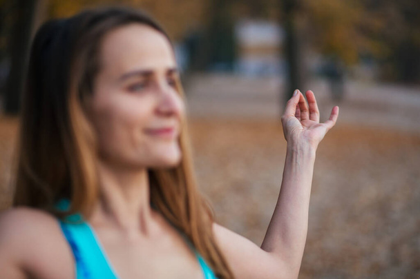 yoga mudra, girl meditate and relaxing in the park - Photo, Image