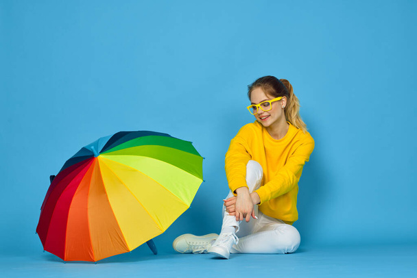 woman with multicolored umbrella in yellow sweater posing rainbow colors - Fotoğraf, Görsel