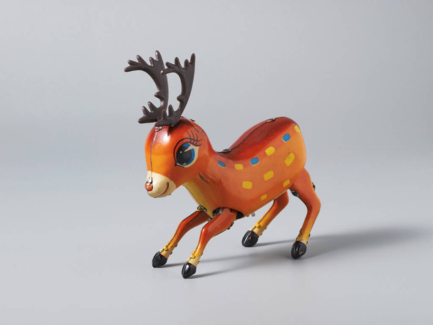 A closeup of a toy reindeer on a white surface - 写真・画像
