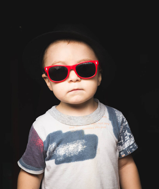 fashionable kid in summer park - Фото, изображение