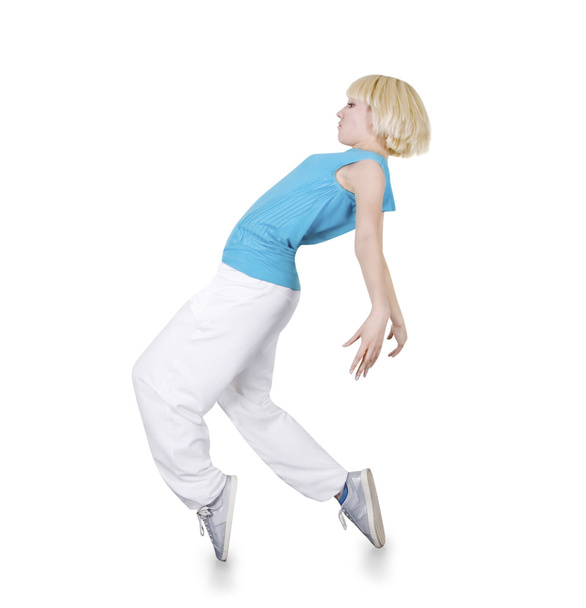 Teenage girl dancing hip-hop over white background - Foto, afbeelding