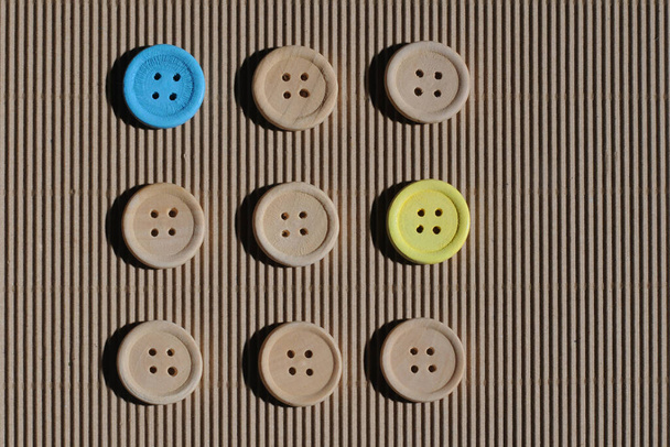 The concept of wooden buttons on brown cardboard ... - Fotoğraf, Görsel