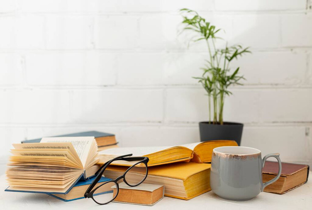 arrangement with books cup. High quality photo - Photo, Image