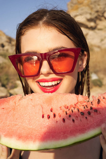 woman eating watermelon outdoors Sun summer close-up - Foto, Imagen