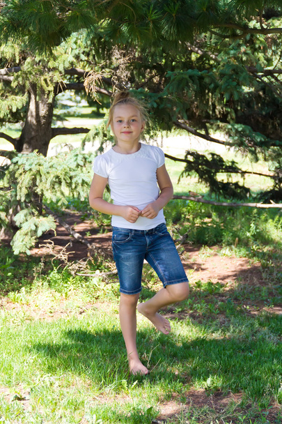 Cute girl standing on one leg - Fotó, kép