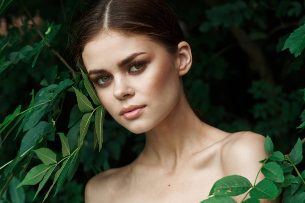 beautiful woman green leaves clean skin nature summer model - Zdjęcie, obraz