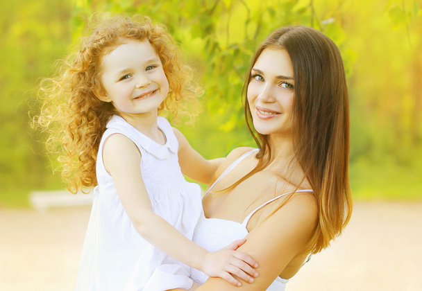 Beautiful mother and daughter - Photo, image