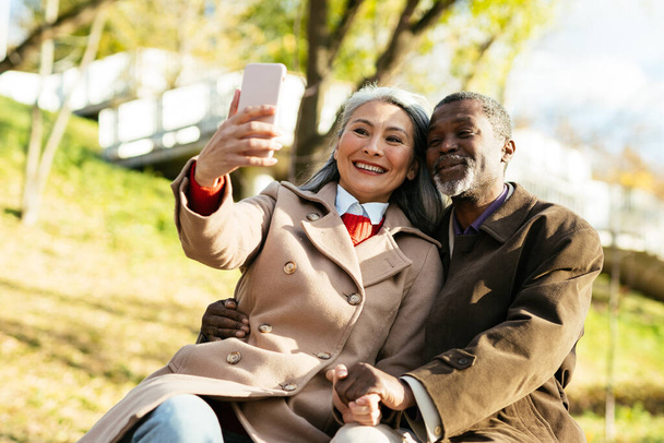 Storytelling image of a multiethnic senior couple in love - 写真・画像