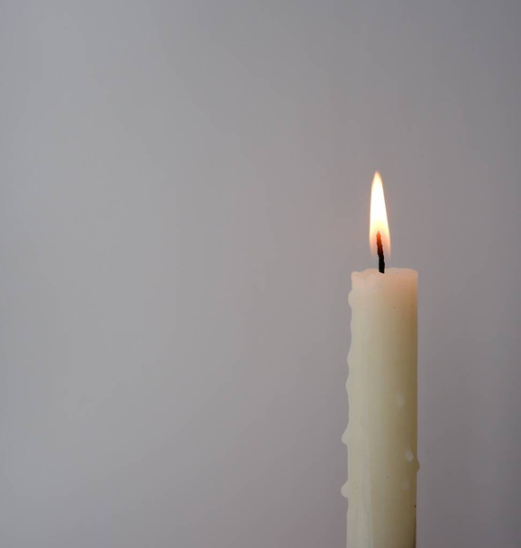 candle on white wall background - Foto, immagini