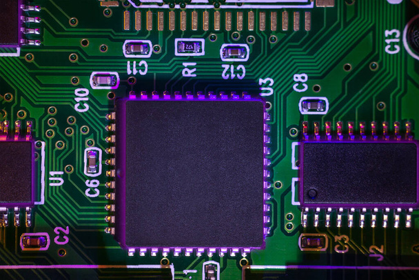 Macro close-up shot of a microchip, processor (CPU) concept of a high-tech control system for artificial intelligence on a board (PCB), central processing unit of a computer with components inside an electronic device - Fotó, kép