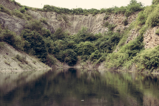 lake inside of a former sandstone quarry in Kielce - 写真・画像