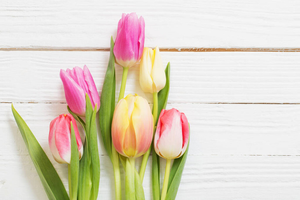 beautiful tulips on white wooden background - Fotoğraf, Görsel