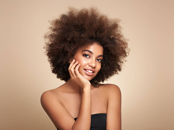 Beauty portrait of African American girl with afro hair. Beautiful black woman. Cosmetics, makeup and fashion - Fotó, kép