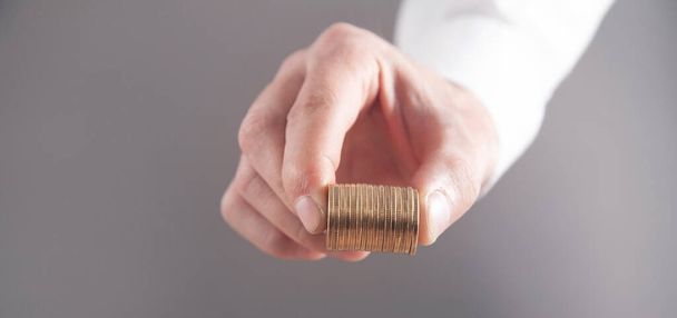 Man showing stack of coins. Business. Finance - Foto, Imagen