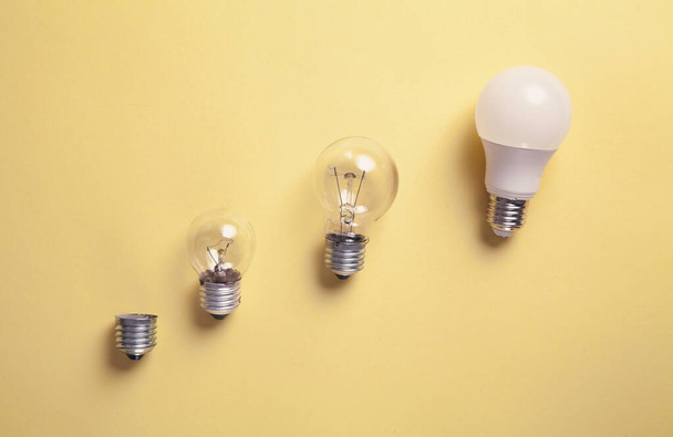 Light bulbs on the yellow background.  - Photo, Image