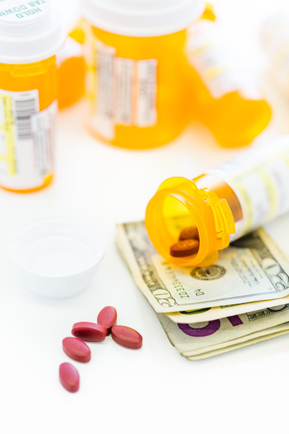 Pillole di prescrizione e banconote da un dollaro
 - Foto, immagini