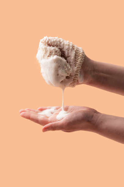 Natural biodegradable washcloth in the female hands - Φωτογραφία, εικόνα