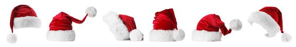 набір капелюхів Санта Клауса на білому тлі
 - Фото, зображення
