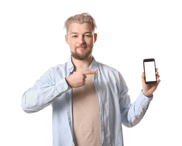 Young man with modern mobile phone on white background - Foto, imagen
